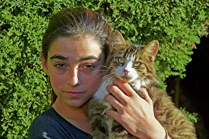 Alpes: 80190189 Girl with Cat Alpes-Maritimes, France M