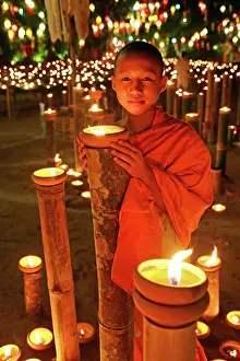 Monks: 80191445 Buddhist Monks at Wat Phan Tao Temple holding