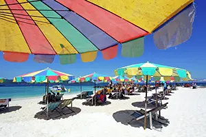 Multi: 80191536 Colourful beach umbrellas and deckchairs