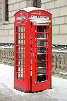 London: 80193376 Snow on a red telephone box, London, England