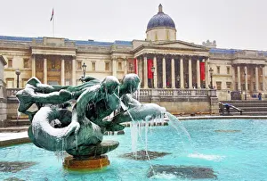 Trafalgar: 80193380 Snow and ice on frozen fountains in Trafalgar