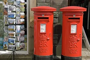 Shops: 80193786 await Two English mail boxes and a postcard