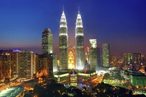 Twin: 80194209 Petronas Twin Towers skyscrapers at sunset