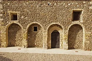 Arches: 80196834 Stone Arches - and doorway on old stone