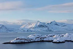 Austvagoy: 80197499 Snow capped Mountains - at the fjord of