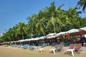 Umbrellas: 80199150 Tropical beach scene with umbrellas on