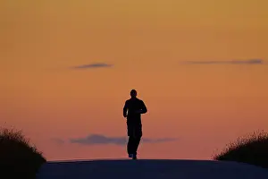 Hobby: 80200084 Jogger - running at sunset in summer Denmark