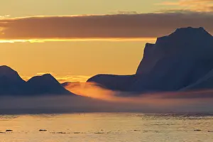 Ilulissat: 80200171 Icebergs - at sunset Ilulissat Icefjord