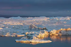 Ilulissat: 80200181 Icebergs - at sunset Ilulissat Icefjord