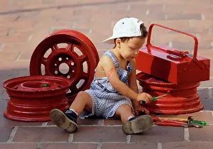 Frederic Rolland: 80200283 Child - boy mechanic in dungarees working
