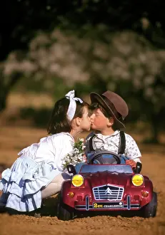 Frederic Rolland: 80200284 Children - boy wearing hat and girl holding