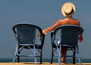 Frederic Rolland: 80201367 Woman - lady wearing sun-hat sitting on