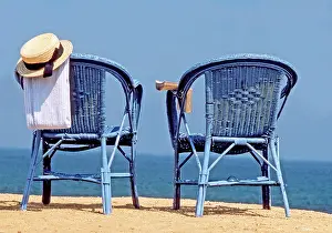 Frederic Rolland: 80201382 Chairs - on beach with sun-hat and towel