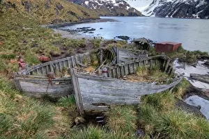 Absence: Abandoned wooden boats on sea shore, Southern