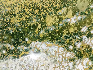 Saline: Abstract patterns in the shallow water of a saline pond in the marshland of the Bahía de Cádiz Nature Reserve