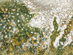 Saline: Abstract patterns in the shallow water of a saline pond in the marshland of the Bahía de Cádiz Nature Reserve