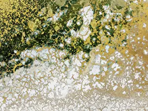 Saline: Abstract patterns in the shallow water of a saline pond in the marshland of the Bahía de Cádiz Nature Reserve