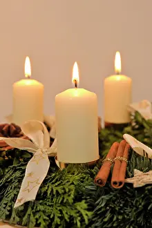 Burning: Advent wreath with three candles burning