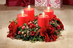 Burning: Advent wreath with four candles burning for the