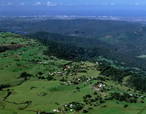 Rises: Aerial - Agricultural land & distant Gold Coast high-rises