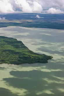Covering: Aerial of cloud shadows on lake