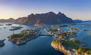 Stadium: Aerial view, evening sun over Henningsvaer with