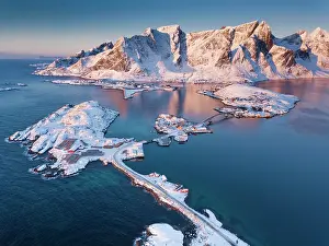 Townsmall: Aerial view, fjord landscape at sunrise, snowy mountains