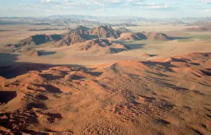 Ridges: Aerial view of grass-grown sand dunes and isolated
