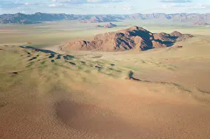 Ridges: Aerial view of grass-grown sand dunes and isolated