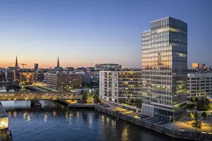 Bridge: Aerial view of HafenCity University Hamburg (HCU) at blue hour with Magdeburger Hafen harbour and bridge