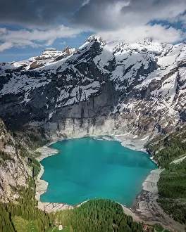 Bern: Aerial view, Lake Oeschinen with snow-covered mountains
