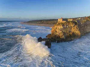 Tower: Aerial view of lighthouse on a cliff with a fortress on the