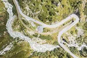 Track: Aerial view of mountain road Furkaroad, railway