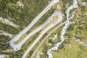 Track: Aerial view of mountain road Furkaroad, railway
