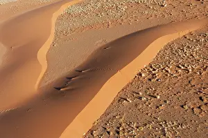 Sesriem: Aerial view over NamibianBarchan Sand Dune at sunrise