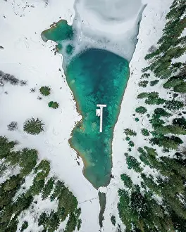 251020: Aerial view, partly frozen Lake Cauma in winter
