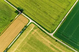 Harvested: Aerial view, paths through green and harvested fields