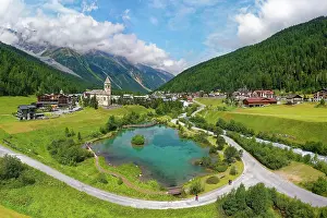 Parish: Aerial view, in front pond, behind parish church