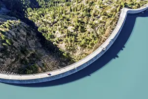 Energy: Aerial view of reservoir dam and lake lac d Emosson