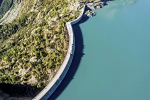 Energy: Aerial view of reservoir dam and lake lac d Emosson