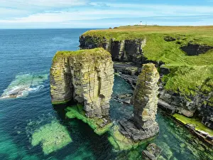 Stack: Aerial view of rock towers, surf pillars on the N