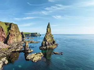 Stacks: Aerial view of the rugged coastal landscape with t