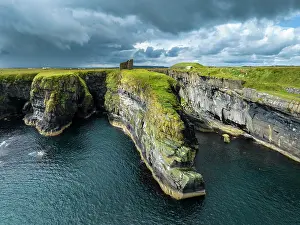 Defence: Aerial view of the ruined Castle of Old Wick surrounded b
