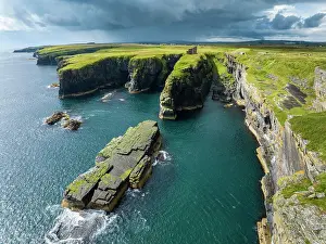 Defence: Aerial view of the ruined Castle of Old Wick surrounded b