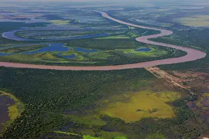 Lowlands: Aerial view of small winding river and savannah