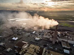 Scrap: Aerial view of smoke pouring from tall stack at