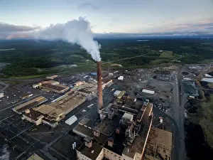 Scrap: Aerial view of smoke pouring from tall stack at