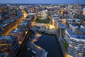 Port: Aerial view of the Speicherstadt Hamburg with Magellan Terraces at Sandtor harbour at blue hour