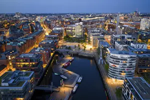 Port: Aerial view of the Speicherstadt Hamburg with Magellan Terraces at Sandtor harbour at blue hour