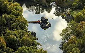 Home: Aerial view, Swiss cottage in the water with footbridge in the biotope wildlife park Anholter Schweiz